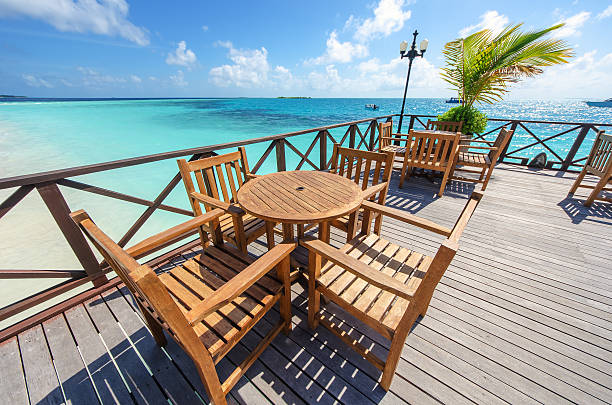 istock Restaurant tables and chairs on the sea view terrace 629322926