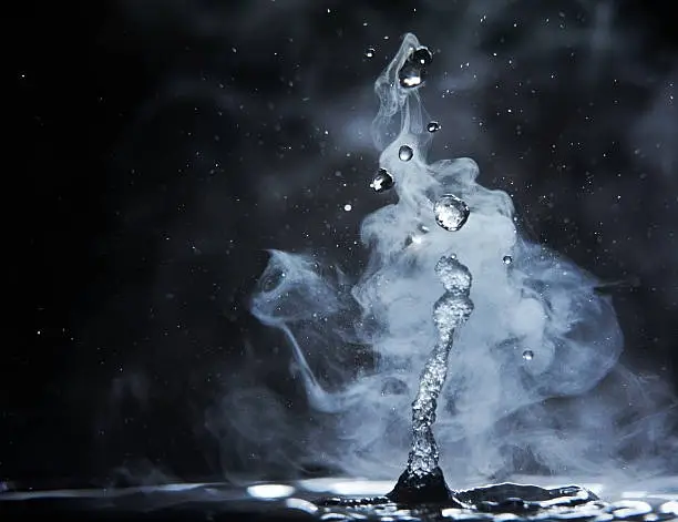 splashes of hot water on black background