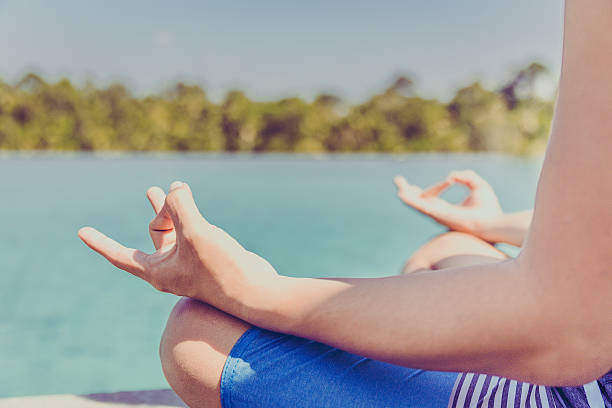 istock Male yoga teacher practicing lotus position 629338374