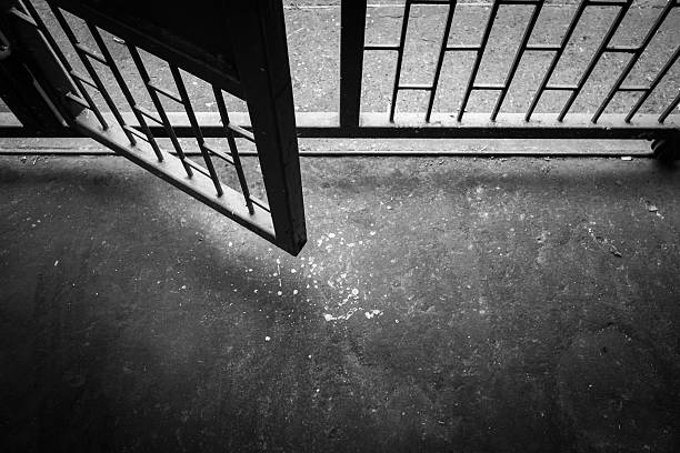old steel door that open to the outside. - prison stockfoto's en -beelden