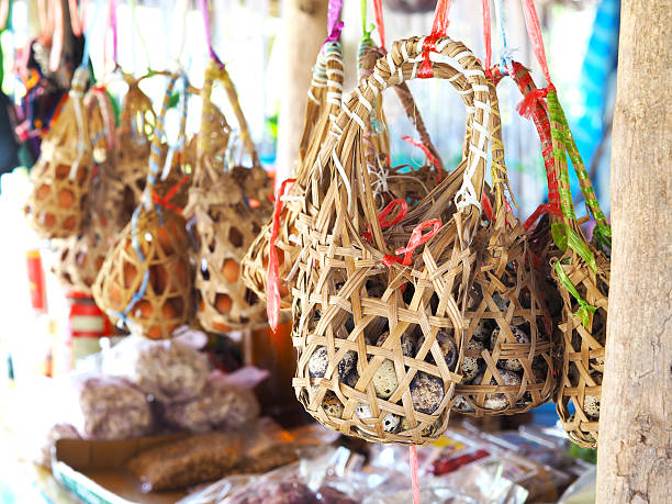 istock Group of hanging bamboo baskets for quail eggs. 629340274