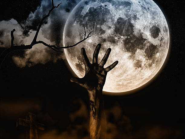 istock Zombie comes out of the grave 629340382