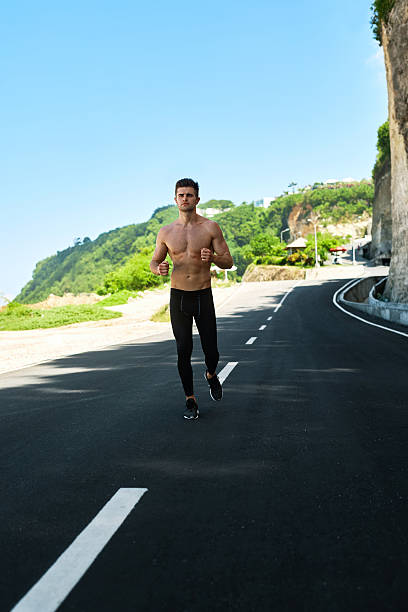 istock Handsome Muscular Man Running And Exercising Outdoors. Sport, Fi 629341818