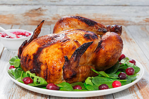 istock whole grilled chicken and arugula, spinach and cranberry salad 629343234