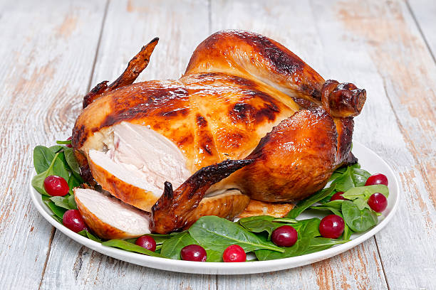 istock whole grilled chicken cut into slices, close-up 629343902