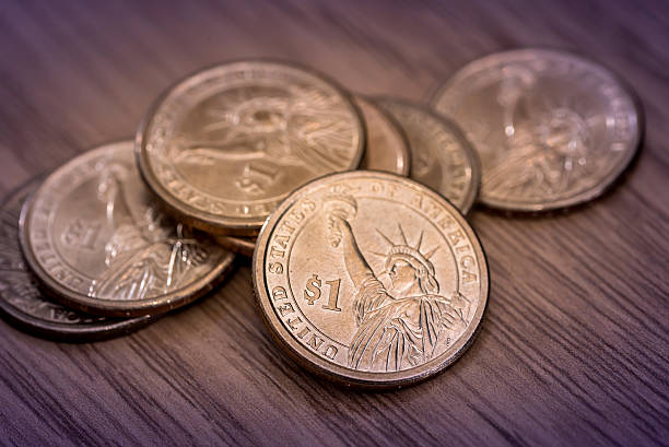 istock us one dollar coin on the desk. 629343968