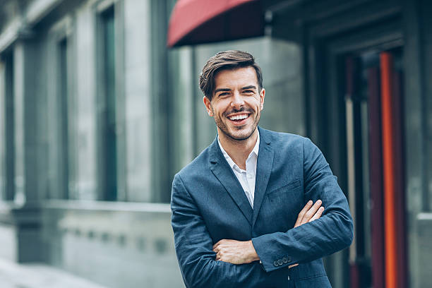 istock Smiling businessman with arms crossed 629353848
