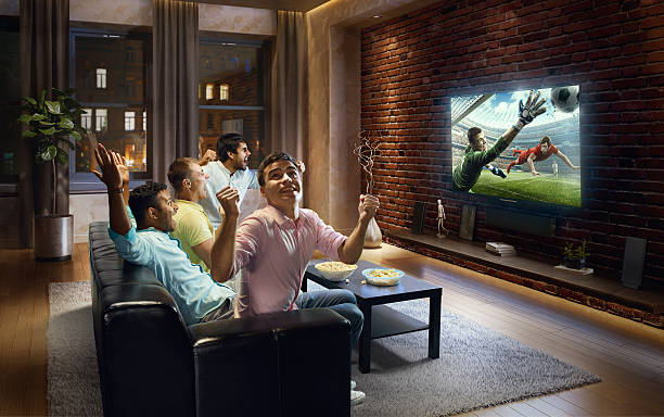 istock Students watching very realistic Soccer game on TV 629354104