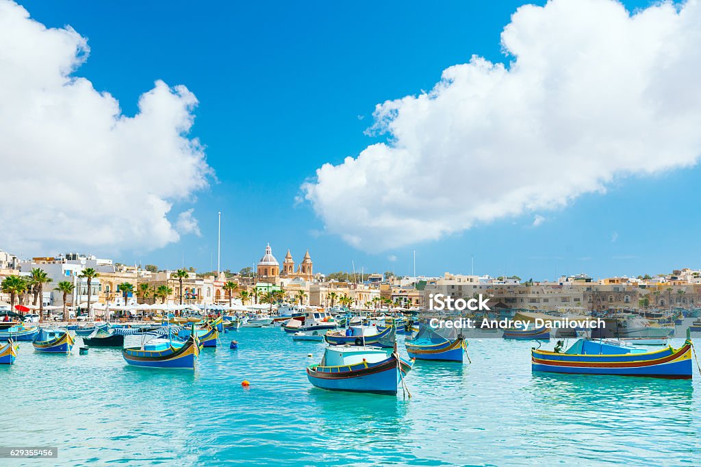 Marsaxlokk Harbor, Malta Marsaxlokk Harbor. Marsaxlokk in Malta is a fishing village in the Southpart famous for its fish market, colourful boats and fish restaurants. Malta Stock Photo