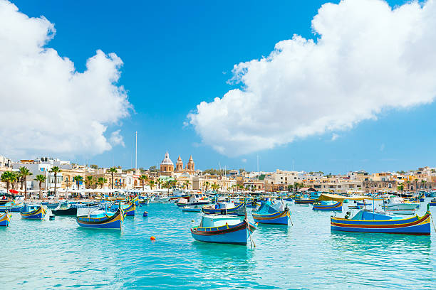 marsaxlokk harbor, malta - public building blue nautical vessel coastline zdjęcia i obrazy z banku zdjęć