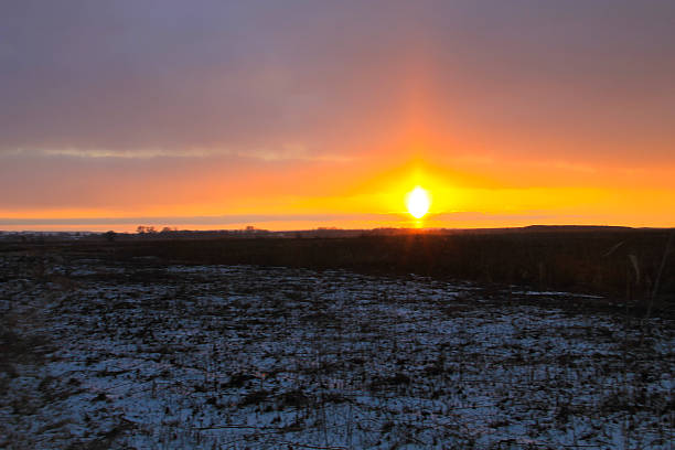 istock Sunset on the winter meadow 629356968