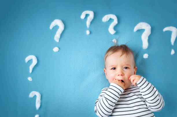 istock little boy with lots of question marks 629357218