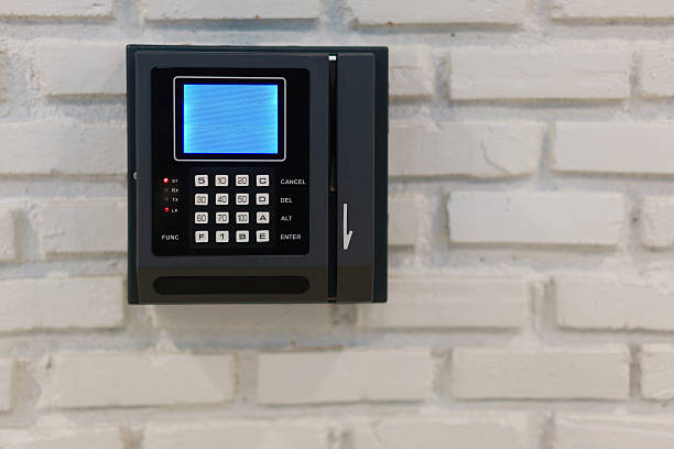 istock Modern bank terminal on a brick wall 629357318
