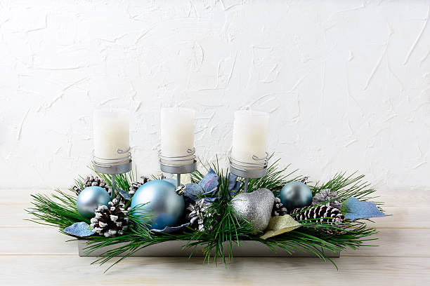 istock Christmas table centerpiece with three candles and blue ornament 629357680