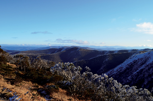View of the surrounding snow capped mountains from the top of Mount Buller, Mansfield, Victoria, Australia