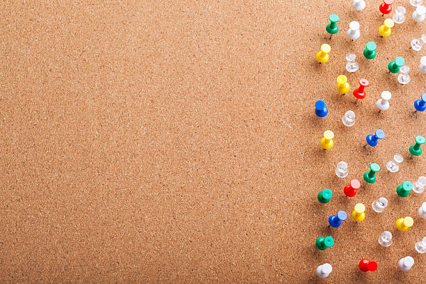 istock Group of thumbtacks pinned on corkboard 629367608