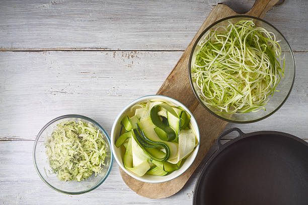 istock Raw zucchini noodles on the white wooden table 629367842
