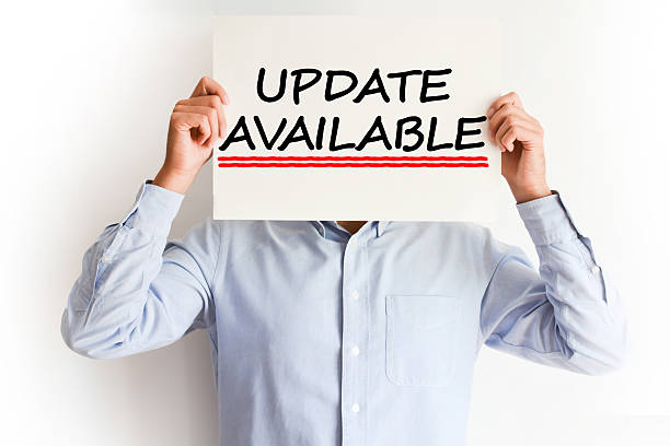 istock Update available concept with young man holding a billboard 629368386