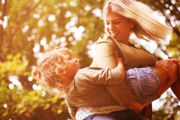 istock Mother and daughter playing outdoor. 629369752