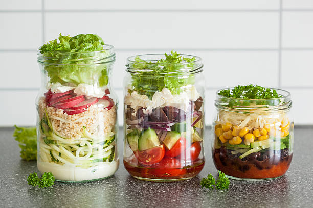 healthy vegetable cheese salad in mason jars
