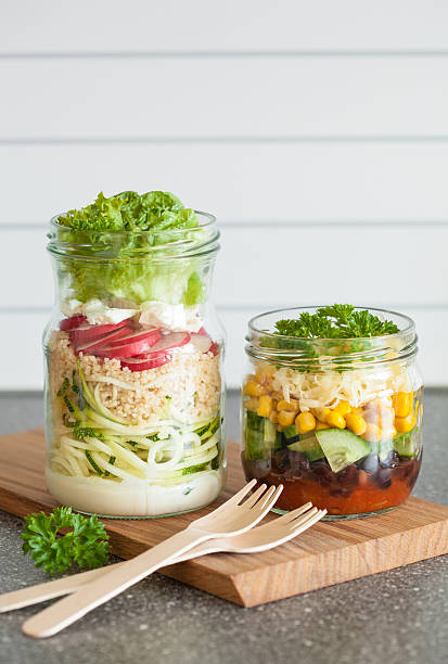 istock healthy vegetable cheese salad in mason jars 629375628