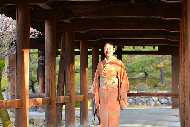 Japanese woman in kimono walking at Tofuku-ji Temple, Kyoto stock photo