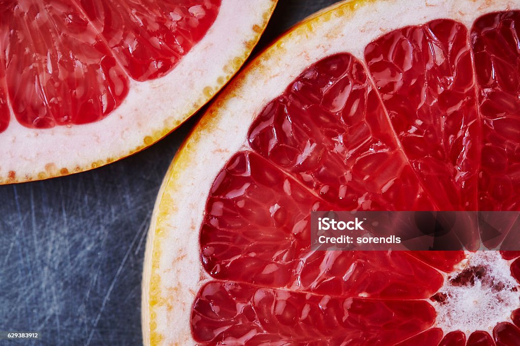 Sliced grapefruit Close-up view of a sliced grapefruit Grapefruit Stock Photo