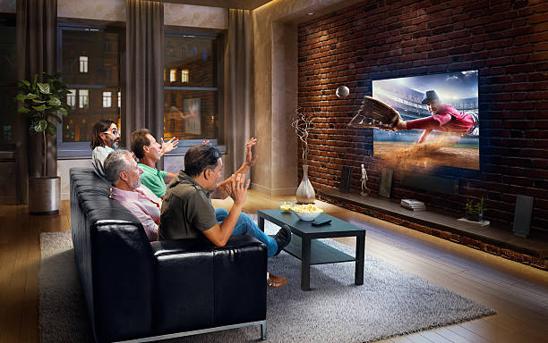 istock Adults watching Baseball game at home 629384700