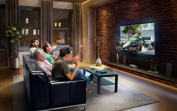 istock Adults watching Car sprint at home 629384898