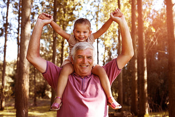 istock Granddaughter enjoying piggyback ride. 629387182