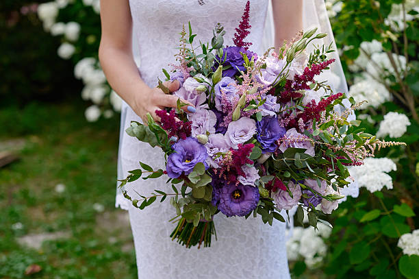 istock bride holding a beautiful bridal bouquet 629387192