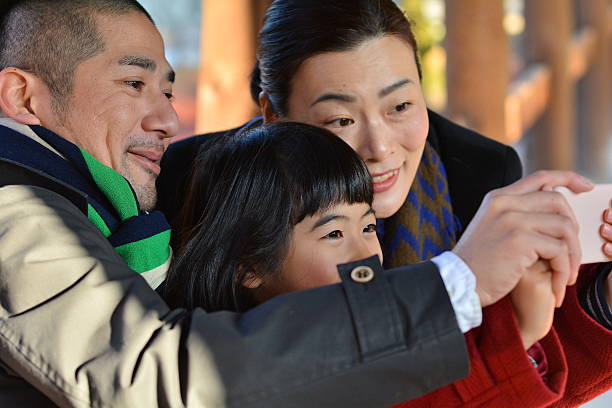 japanese family taking picture at Tofuku-ji Temple, Kyoto stock photo