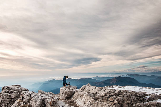 istock Trekker stretching on the top mountain 629390700