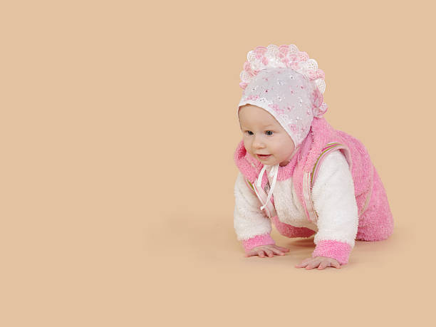 istock Little baby girl crawling. 629391478