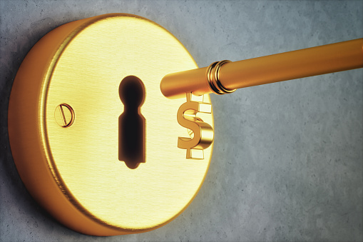 Dollar shaped golden key and key hole.