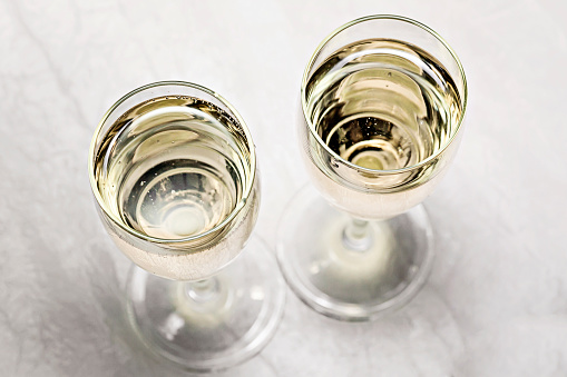 two glasses of champagne in a close-up top view.