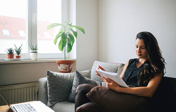 Young woman reading at home