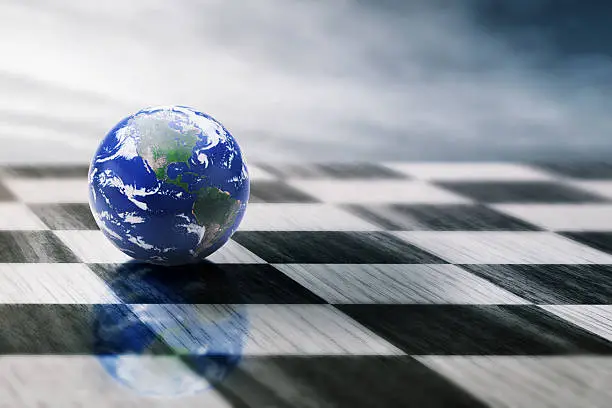 Photo of world on chessboard. Global politics concept