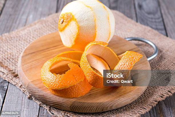 Peeled Orange On The Wooden Background Stock Photo - Download Image Now - Peel - Plant Part, Orange - Fruit, Fruit