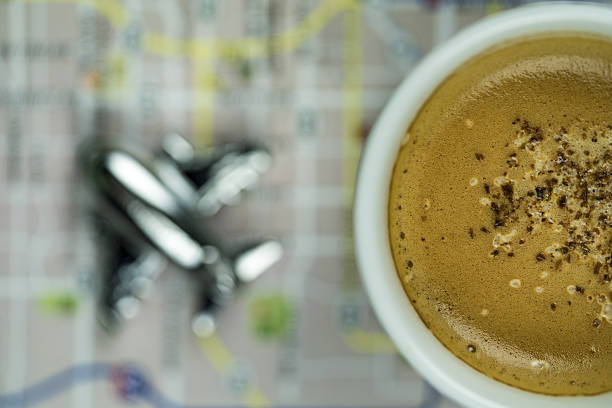 Frothy Cappuccino on Map with Silver Airplane