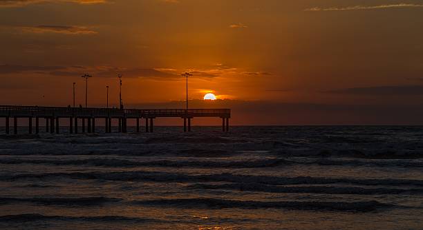 istock Sunset over pier on Gulf Coast 629404586