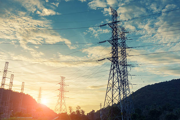 istock High voltage towers on skies background, Transmission line tower. 629406404