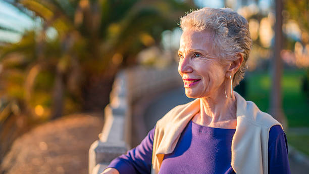 istock Senior woman outdoors looking at view. 629406636
