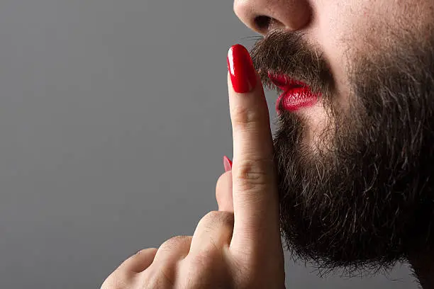 Photo of Transgender Making Silence Gesture