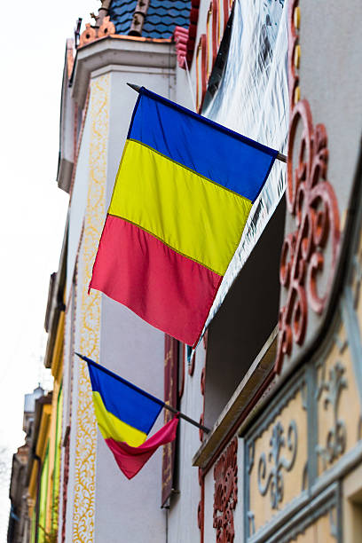 istock Close up of Romanian Flags attached to a building 629413946