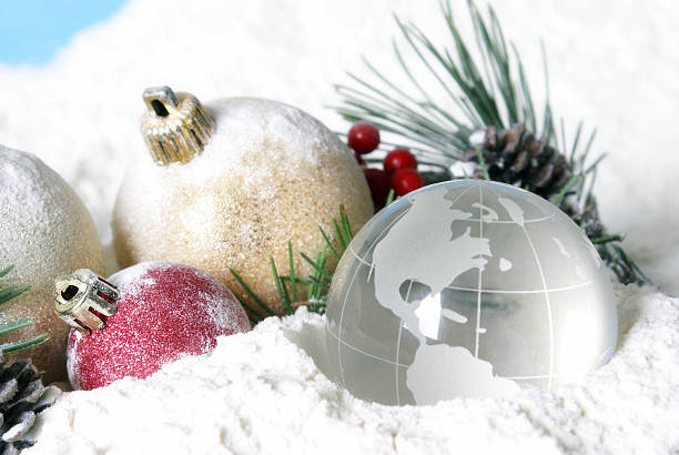 istock Snowy Christmas Pines Baubles and Globe 629418696