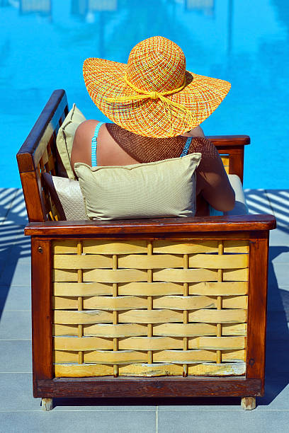 istock Real female beauty relaxing at swimming pool 629419246
