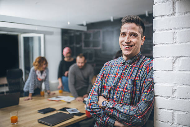 photo of young business man in a conference room - speech recruitment technology young adult imagens e fotografias de stock