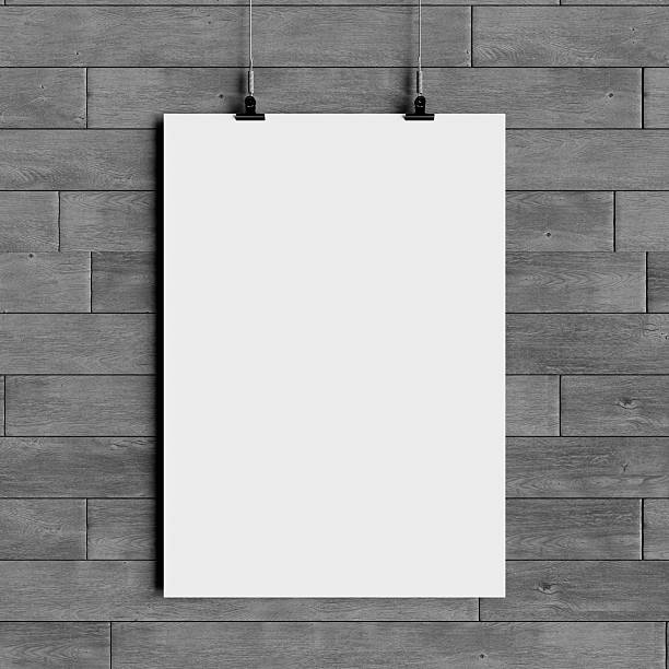 istock Paper blank poster template hanging over wall. 3D illustration 629441124