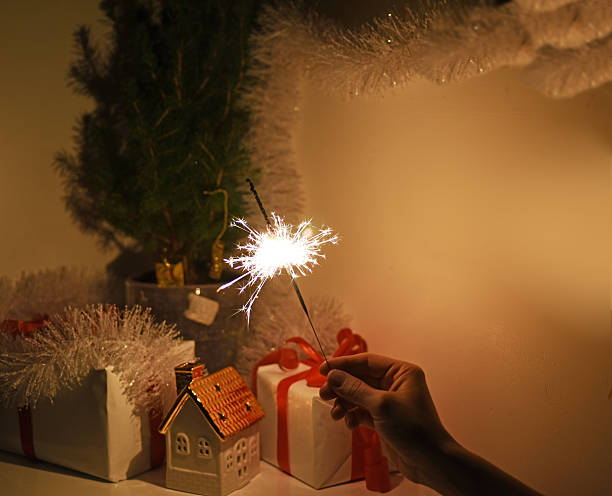 istock Christmas sparklers in darkness. New Year decorations on background. 629441358
